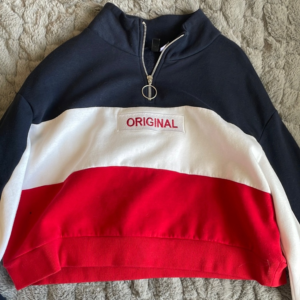 “original” printed cropped crewneck in the colors red, white, and blue